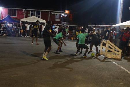 Action at the Back Circle Tarmac in the ‘Settlement of all Arguments’ Street-ball Championship.