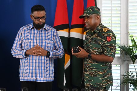 President Irfaan Ali (left) listening as the operation of the camera was explained (Ministry of Home Affairs photo)
