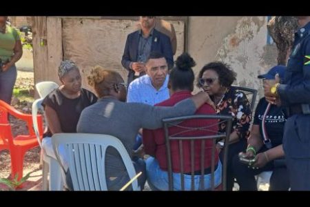 Prime Minister Dr Andrew Holness sits in discussion with Georgette Anderson (in burgundy blouse), mother of Kelsey Ferrigon, while Juliet Cuthbert Flynn (left), state minister in the Ministry of National Security; Olivia Grange, member of parliament for St Catherine Central; and Theresa Turner Flynn, councillor for the Hampton Green Division in the constituency, look on.