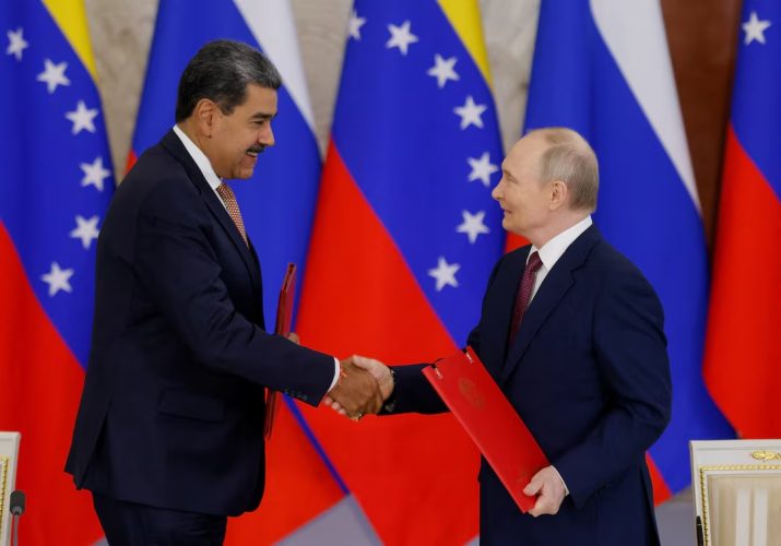Russian President Vladimir Putin shakes hands with Venezuelan President Nicolas Maduro during a signing ceremony following their talks at the Kremlin in Moscow, Russia, May 7, 2025. REUTERS/Maxim Shemetov