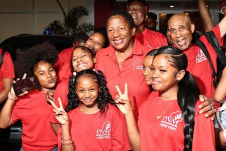 Pennelope Beckles-Robinson takes a photo with party supporters outside Balisier House, Port-of-Spain, after being chosen as Opposition Leader yesterday.