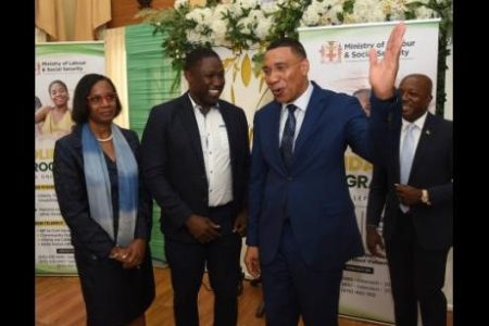 Prime Minister Dr Andrew Holness (second right) shares a moment with (from left) Dione Jennings, permanent secretary in the Ministry of Labour and Social Security; Wavell Hinds, representative of the parliamenary Opposition; and Pearnel Charles Jr, minister of labour and social security. The occasion was the launch of the Solidarity Programme at Jamaica House in St Andrew on Wednesday.