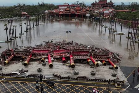 The collapsed archway of Nankunshen Daitian temple and the flooded courtyard in the aftermath of Typhoon Danas in Tainan on Jul 7, 2025. (File photo: AFP/Johnson Liu)
