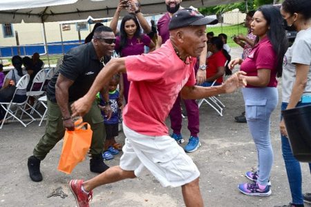 CAN’T BEAT ME!: Former Trinidad and Tobago athlete Reginald Brown, who represented the nation in track and field at in 1972 , shares a light moment with Minister of National Security and Tunapuna MP Roger Alexander during a mock race at the Tunapuna Community Health Fair. The event, hosted by the TT Health and Nutrition Association in partnership with the Tunapuna Constituency Office, was held at the corner of Green Street and El Dorado Road, Tunapuna.
@Sun Caption:—Photo: JERMAINE CRUICKSHANK
