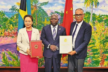 China Ambassador Yan Jiarong, Prime Minister Philip Davis and Health Minister Dr Michael Darville at the signing of the loan for the new hospital. Photo: Nikia Charlton