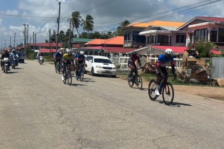 Kwame Ridley (in front) leading the peloton’s pursuit of Jamual John and eventual winner Alex Newton
