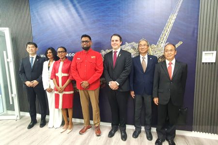 President Irfaan Ali (centre) and Minister Oneidge Walrond (3rd left) flanked by MODEC’s  Group Chief Operating Officer Katsuyuki Imaizumi (2nd right) and Country Manager, Rafael Fumis (3rd right); Japanese Ambassador to Guyana Dr. Akima Umezawa (1st right) and MODEC employees 