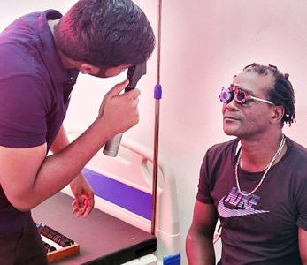 Naveen Kumar from Balwant Singh Hospital performing an eye test. Spectacles will be made by Balwant Singh and sent back for distribution, courtesy Ministry of Health Voucher Programme