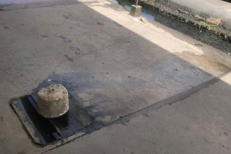   Another manhole on the pavement outside the Post office 