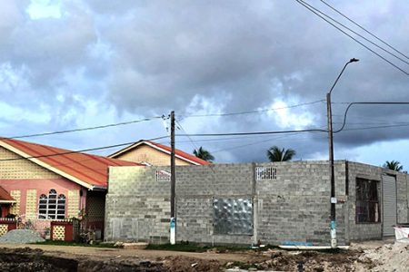 The business that is being constructed next to the church. 