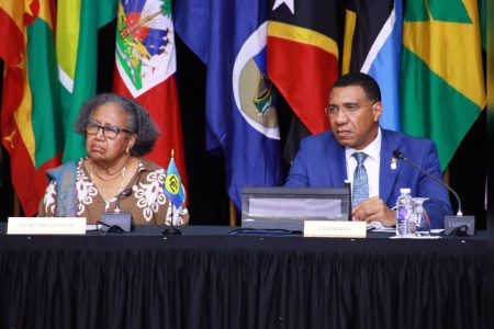 Caricom Chair Andrew Holness, right, and Secretary General Dr Carla Barnett address journalists at the closing media conference for the 49th Regular Meeting of the Conference of Caricom Heads of Government in Montego Bay, Jamaica, yesterday.CHE TEEKERSINGH