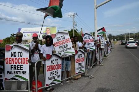 Protesters outside the Montego Bay Convention Centre in St James on July 6, ahead of the 49th CARICOM Heads of Government Meeting. - Ashley Anguin photo.