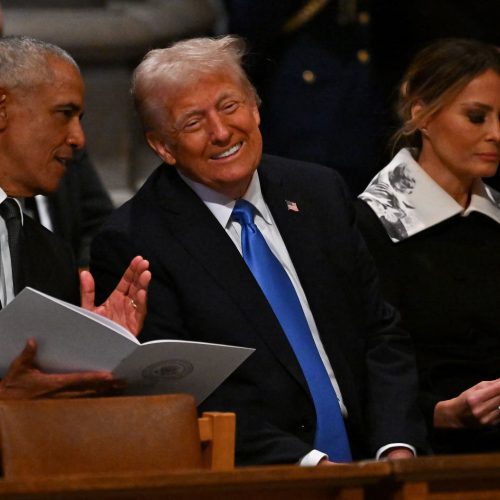 Former U.S. President Barack Obama and U.S. President-elect Donald Trump speak at an event in Washington, D.C. on January 9, 2025. Ricky Carioti/Pool via REUTERS/File Photo
