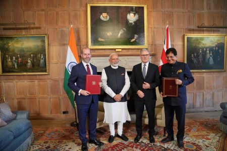 Britain's Prime Minister Keir Starmer and Prime Minister Narendra Modi of India pose for a photo after Britain's Secretary of State for Business and Trade, Jonathan Reynolds and Piyush Goyal, Minister of Industry and Supply of India, signed a free trade agreement at Chequers near Aylesbury, England, Thursday, July 24, 2025. Kin Cheung/Pool via REUTERS