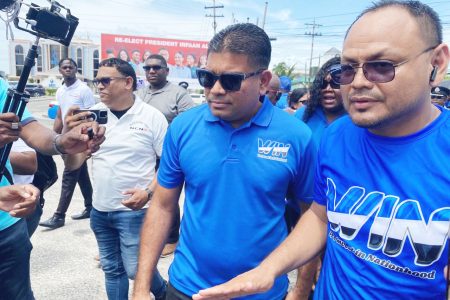 WIN’s party presidential candidate Azruddin Mohamed (left) and an ally, Mark Defrance of ANUG as they left the Umana Yana compound in Kingston 