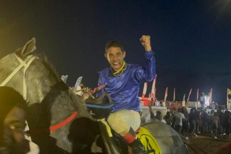 Master Z Stable’s jockey celebrates atop Data Man after clinching the 2025 edition of the Guyana Cup.