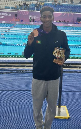 Guyana’s Raekwon Noel poses with his Junior Pan Am Men’s 200m Butterfly bronze medal after yet another record-setting swim. (Photo credit: Stephanie Fraser)