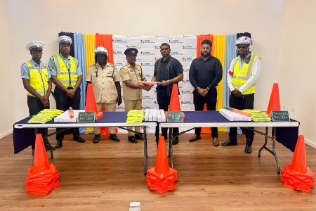 The handing over traffic cones and other items (Massy photo)
