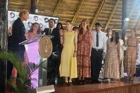 Peace Corps Volunteers taking their oath of service