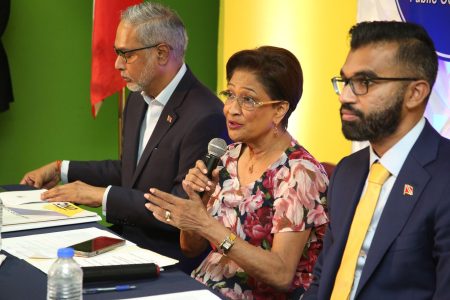 Prime Minister Kamla Persad-Bissessar addresses the public consultation on the proposed stand-your-ground law at her constituency office in Penal on Tuesday. With her are Minister in the Office of the Prime Minister Darrell Allahar, left, and Minister of Legal Affairs Saddam Hosein.