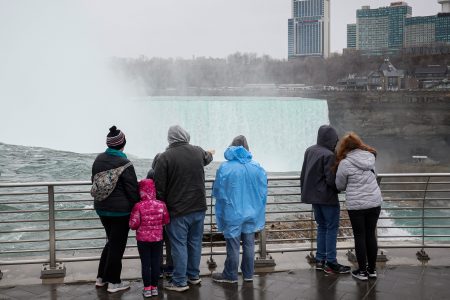Tourists look at the Horseshoe Falls, ahead of the Solar Eclipse that will take place across parts of the United States and Canada on April 8, at Niagara Falls, New York, U.S., April 5, 2024. REUTERS/Brendan McDermid/