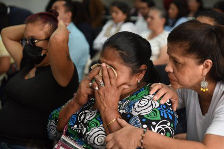 A woman reacts as mothers of victims and survivors of the 2017 fire at the Virgen de la Asuncion shelter attend the trial over the deaths of 41 children, in Guatemala City, Guatemala, August 12, 2025. REUTERS/Cristina Chiquin