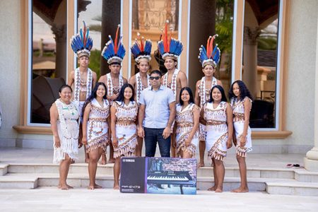 Azruddin Mohamed (centre) with the members of the Surama group and the keyboard
