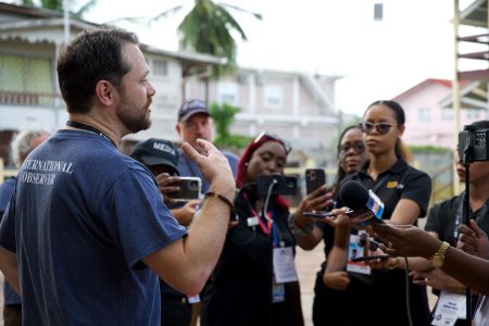 Head of the Carter Center observer team, Jason Carter (left) speaking to reporters on election day (The Carter Center Facebook page) 